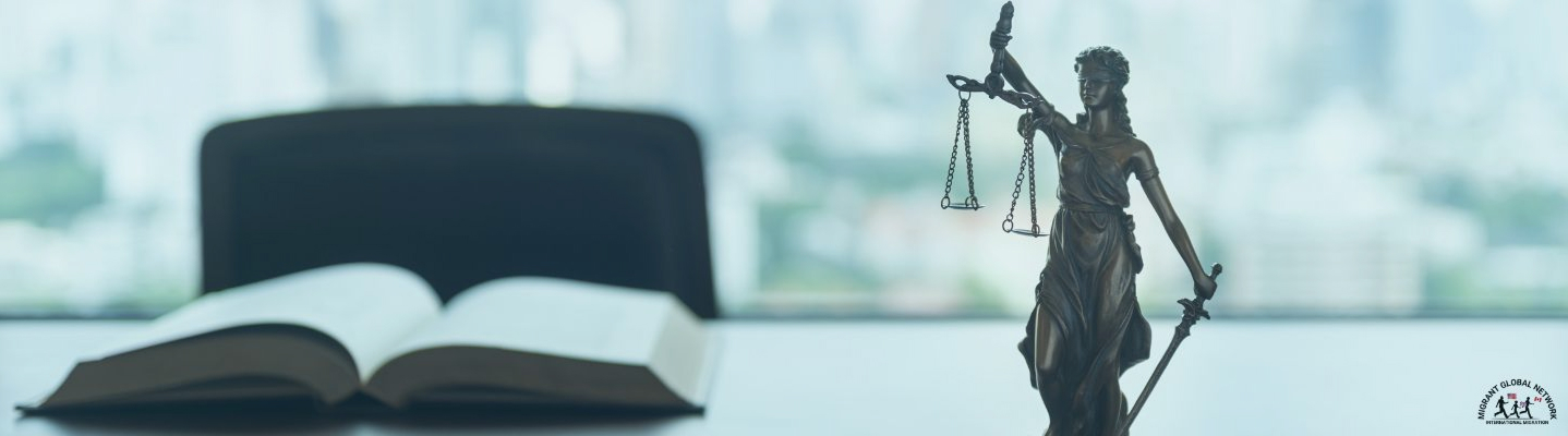 Scales of justice and law books on a desk