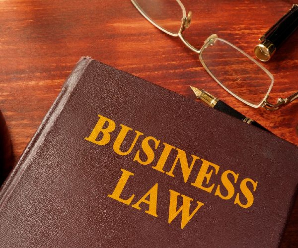 Business Law book on a desk with glasses