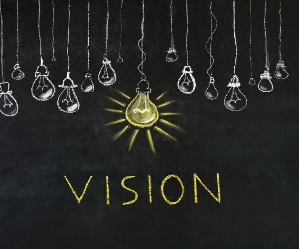 Hanging lightbulbs with one illuminated, representing vision